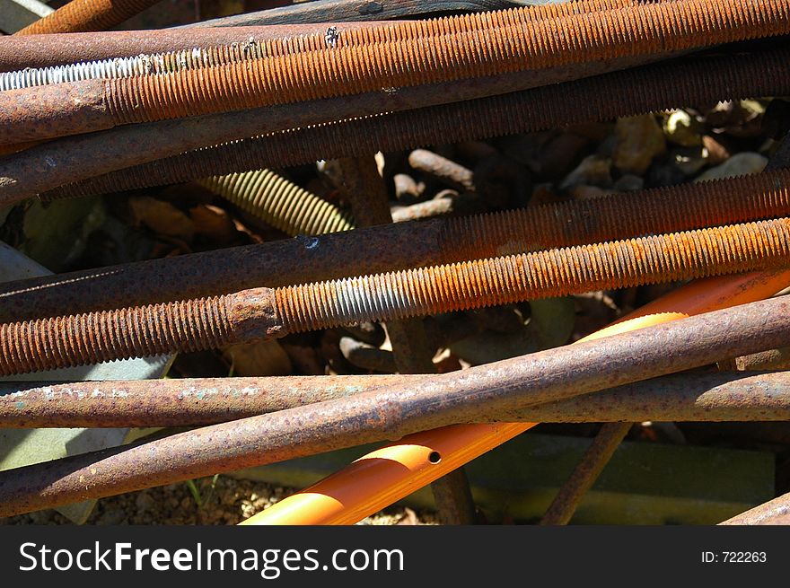 Assorted discarded steel poles and scaffolding