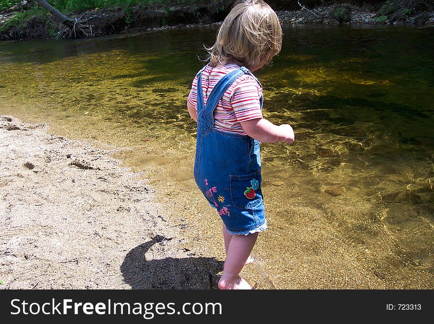 Little girl by the water