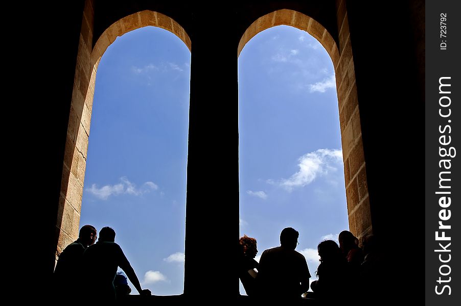 Silhouette of peoples and windows at a castle