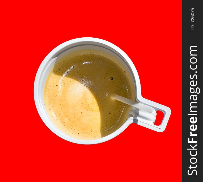 A cup of coffee (espresso) at red background