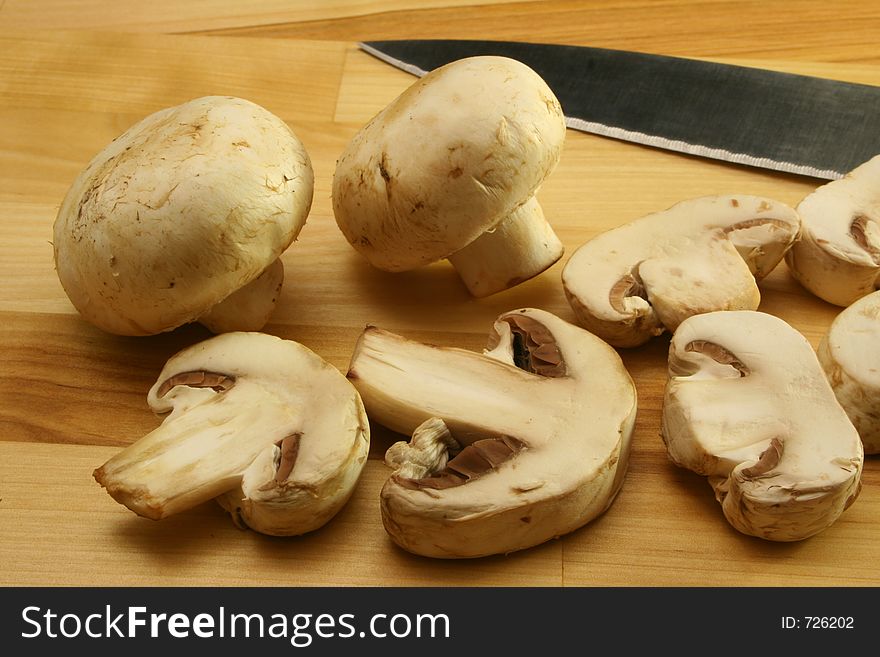 Mushrooms on Cutting Board with Knife. Mushrooms on Cutting Board with Knife