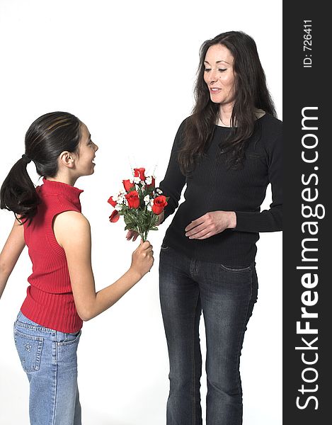 Daughter offering flowers to her mother. Daughter offering flowers to her mother
