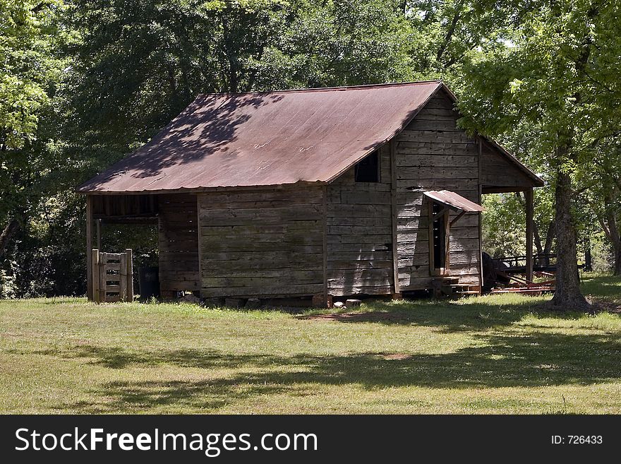 An old shed or barn in a clearing