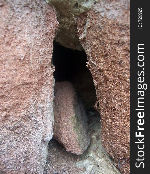 A piece of sandstone in a sandstone crevice. A piece of sandstone in a sandstone crevice