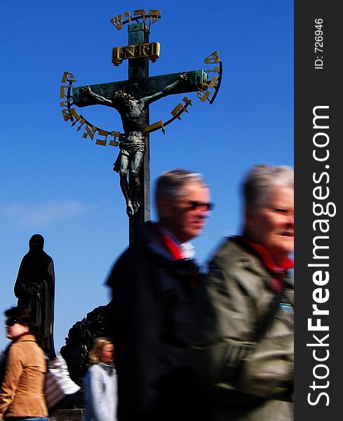 A cross statue on the Charles Bridge in Prague, Czech Republic. A cross statue on the Charles Bridge in Prague, Czech Republic.