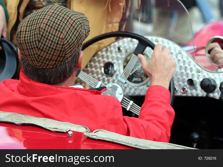 Man in a retro automobile. Man in a retro automobile