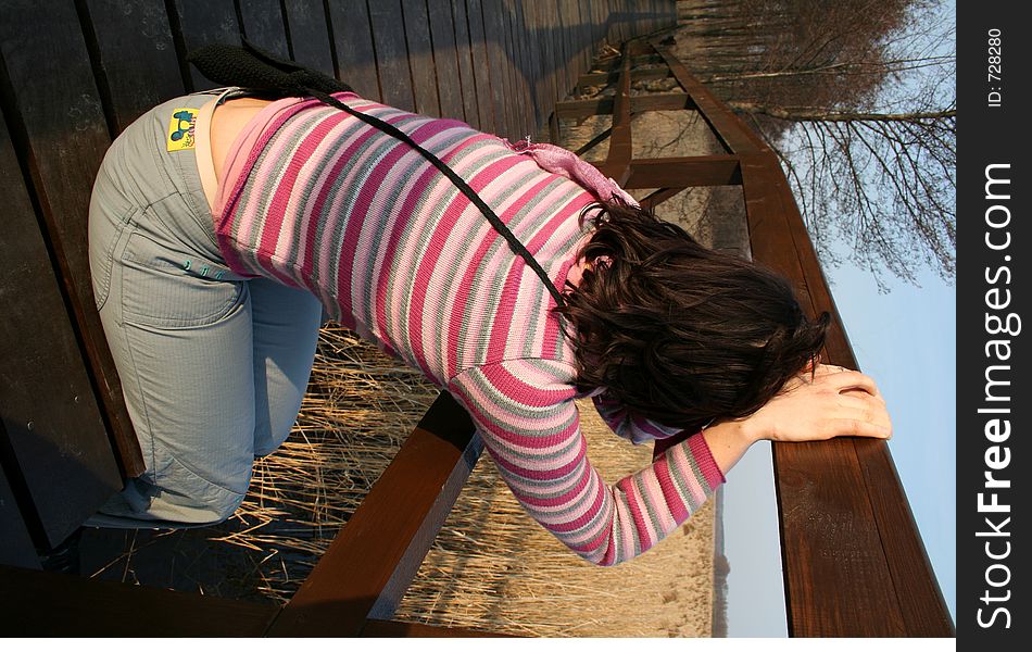 Girl waiting on a wooden bridge. Girl waiting on a wooden bridge