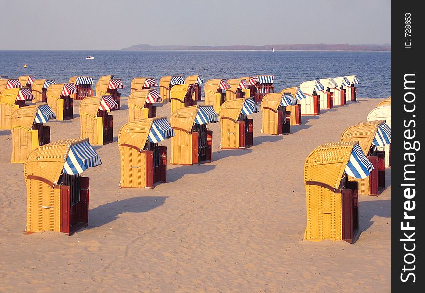 Roofed wicker beach chairs