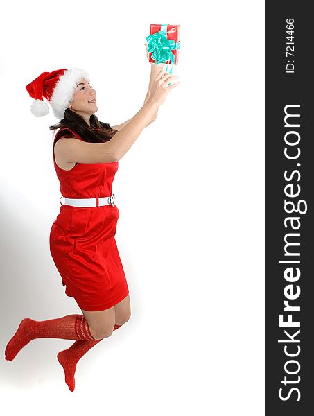 Christmas girl jumping to catch a gift