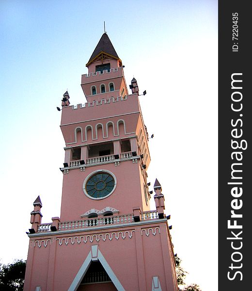 Wedding tower with stained-glass window in Harbin, China, evening view with backlit, pink light