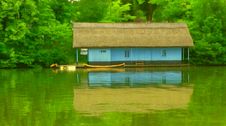 Overfiltered Blue Wooden Vintage House On The Lake In Autumn Season Stock Images Overfiltered Blue Wooden Vintage House On The Lake In Autumn Season Stock Images