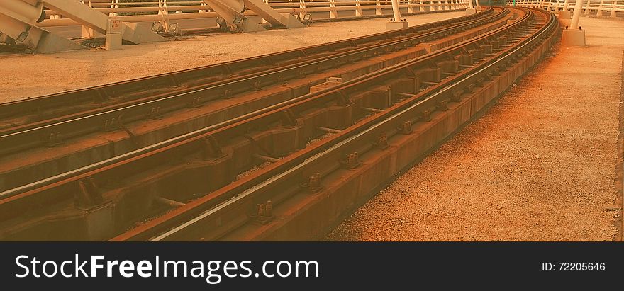 Soft rusty view with colorful lonely railroad in paved structure. Soft rusty view with colorful lonely railroad in paved structure