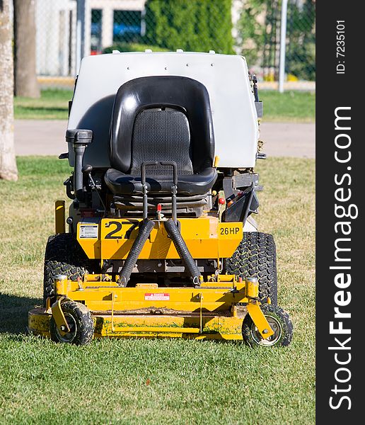 Riding lawn mower used for large areas. Riding lawn mower used for large areas