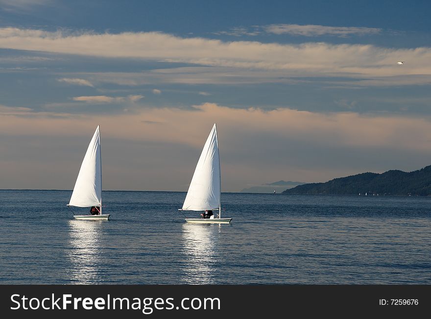 Two sailing boats in the sea. Two sailing boats in the sea.