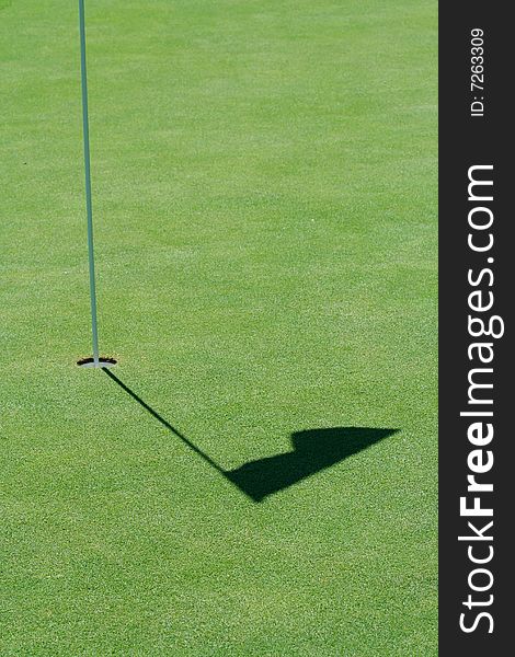 A Golf green flag shadow