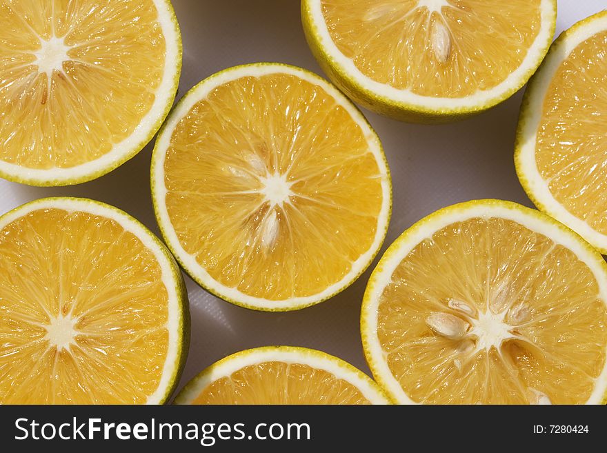 Fresh oranges cut open and lit by sunlight. Fresh oranges cut open and lit by sunlight.