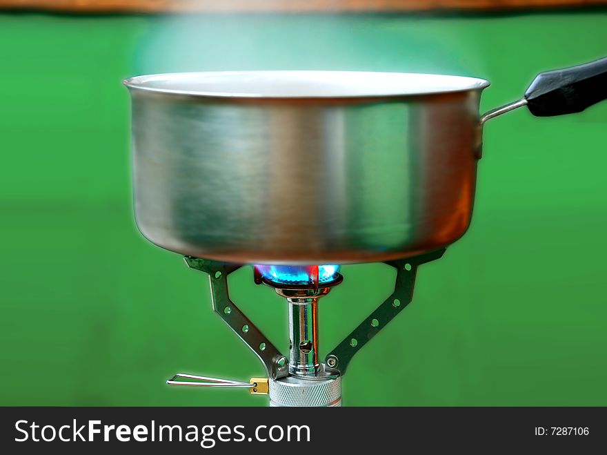 A stainless steel pan on a stove. A stainless steel pan on a stove