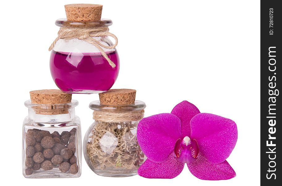 Pink orchid and small bottles. spa concept