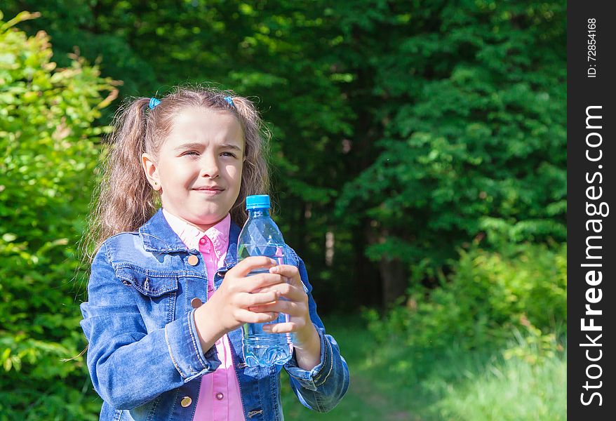 Girl holding a water bottle