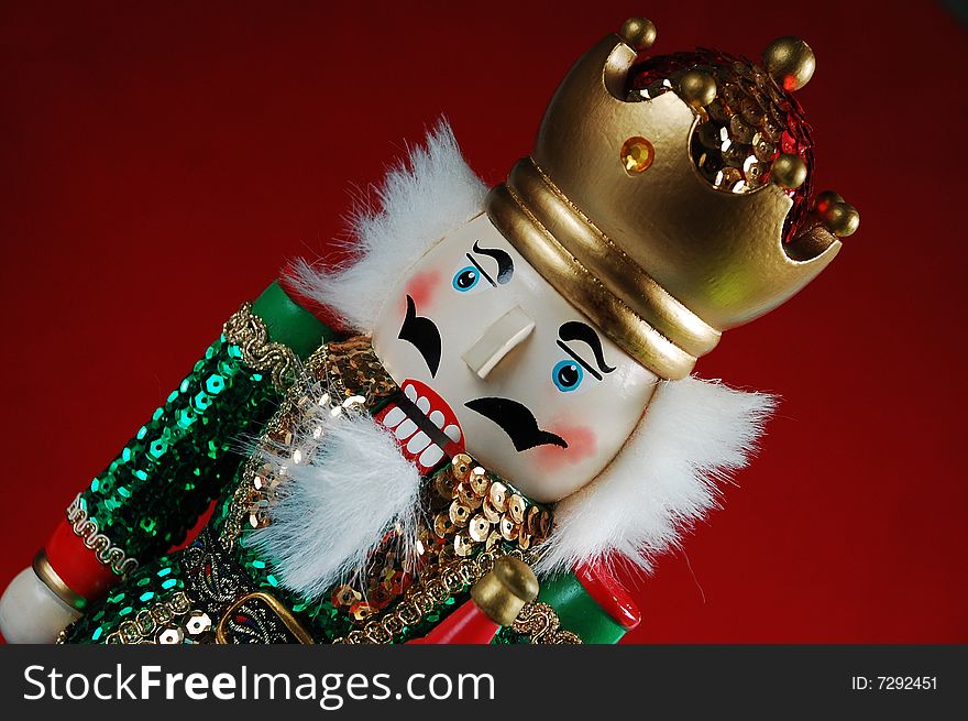 Christmas nutcracker on red background