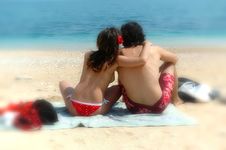 A Cute Couple Cuddles On An Italian Beach Royalty Free Stock Images
