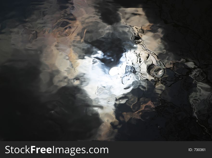 Reflection of sunny sky in water. Reflection of sunny sky in water