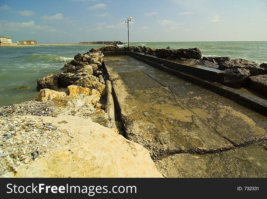 A rocky pier at Olimp resort Black Sea - Romania. A rocky pier at Olimp resort Black Sea - Romania