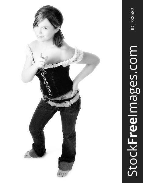 Beutiful young woman with hand on hip and finger pointed to camera. Shot in studio over white. Beutiful young woman with hand on hip and finger pointed to camera. Shot in studio over white.