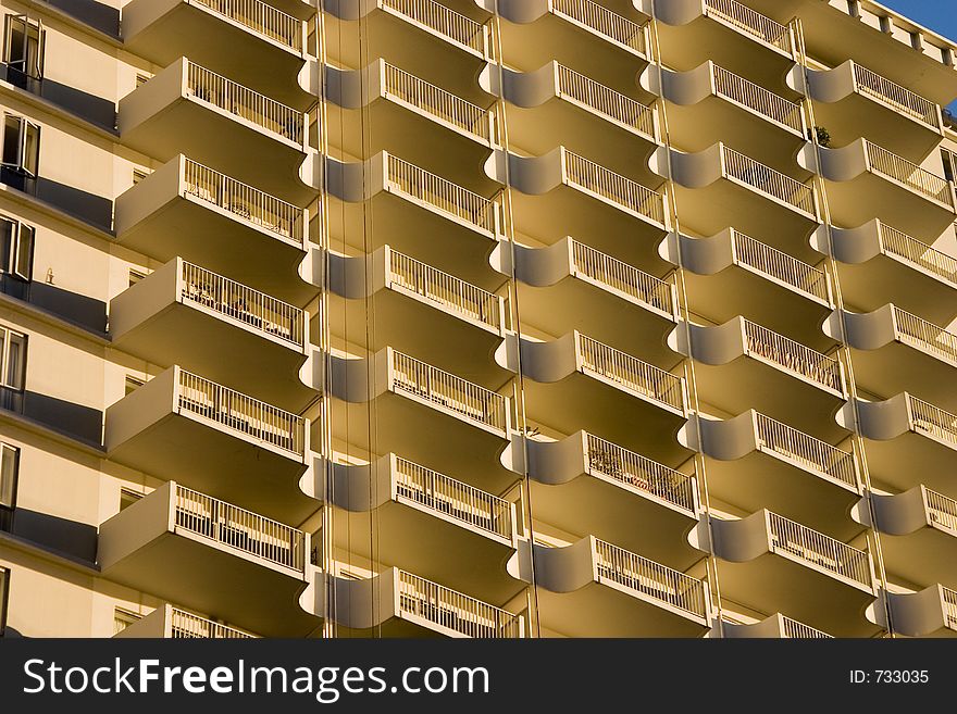 Urban balconies lit by the morning sun. Urban balconies lit by the morning sun.