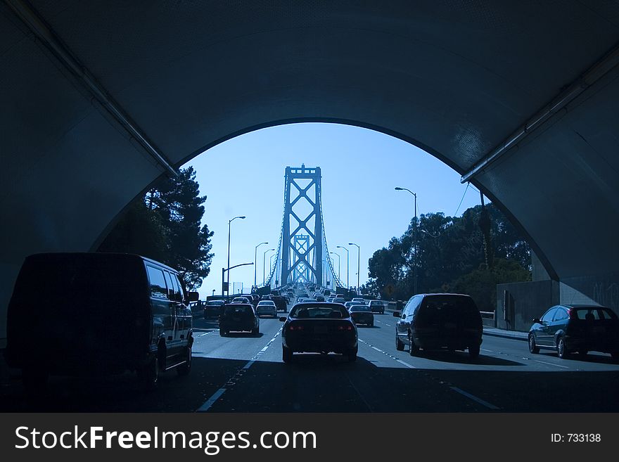 Cars emerge from a tunnel leading to San Franciscoï¿½s Bay Bridge. Cars emerge from a tunnel leading to San Franciscoï¿½s Bay Bridge.