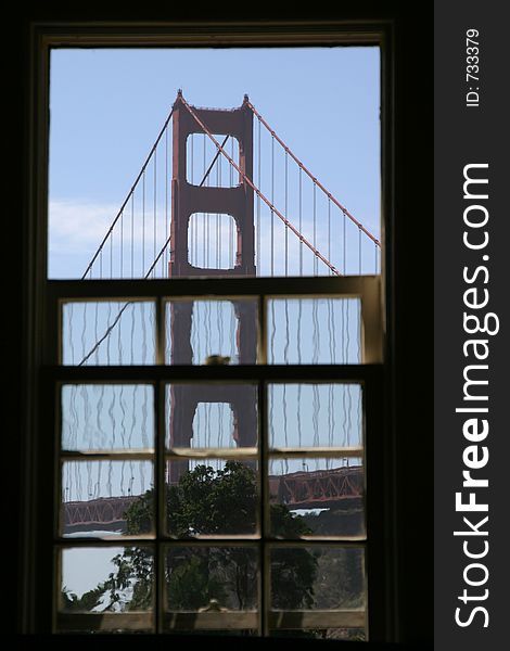 Looking out a window towards the golden gate bridge. Looking out a window towards the golden gate bridge.