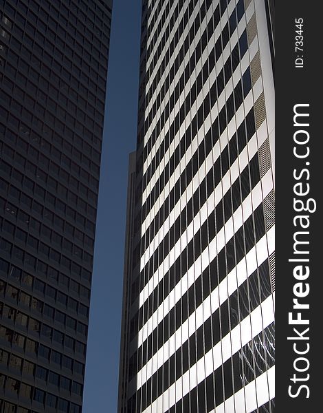 The canyon of glass and metal between two sky scrapers. The canyon of glass and metal between two sky scrapers.