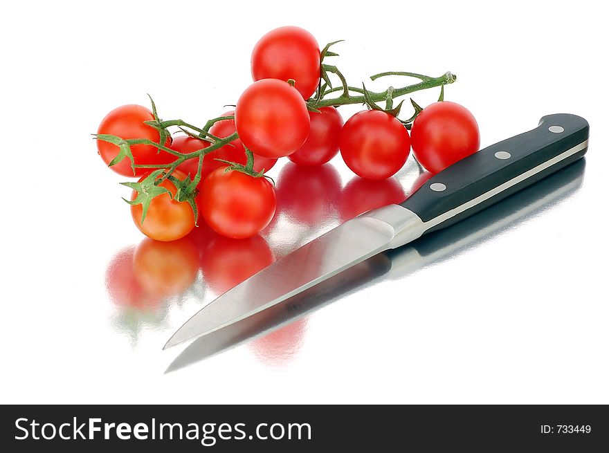 Tomatoes and knife. Look in profile for more