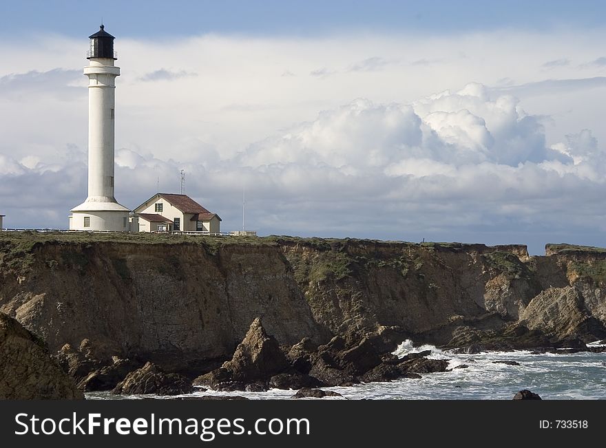 A lighthouse on the rugged cliffs of Point Arena, California. A lighthouse on the rugged cliffs of Point Arena, California.