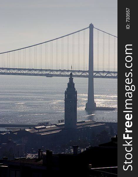 A view of San Francisco�s waterfront; the ferry building and bay bridge. A view of San Francisco�s waterfront; the ferry building and bay bridge.