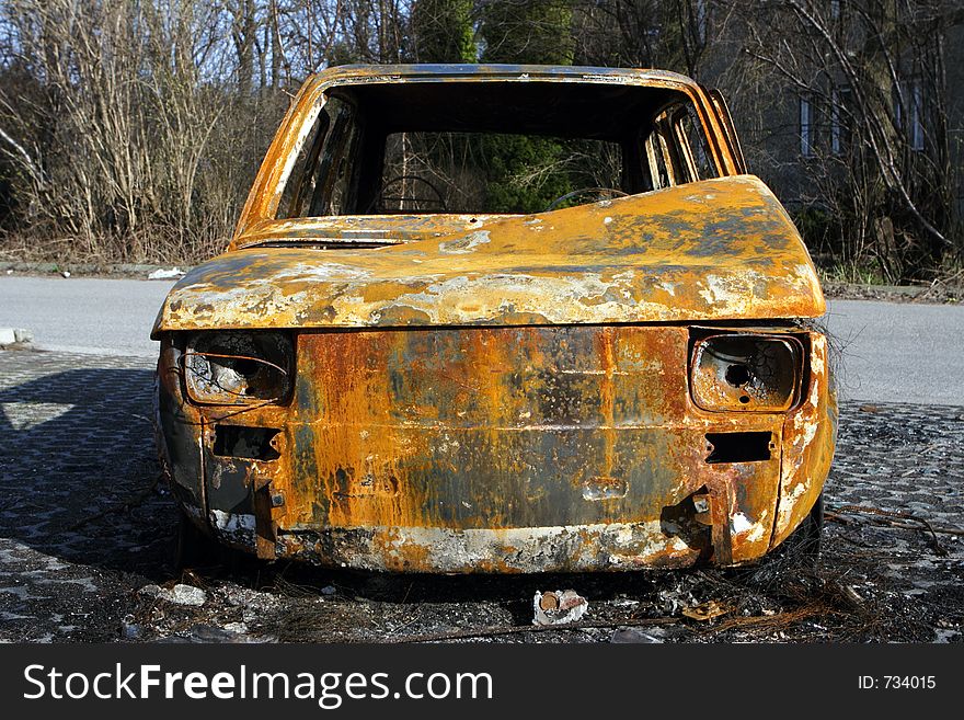 Burned car on the road side. Burned car on the road side