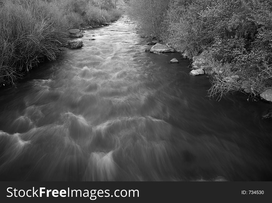 Smooth flow of a river or creek in the spring. Smooth flow of a river or creek in the spring