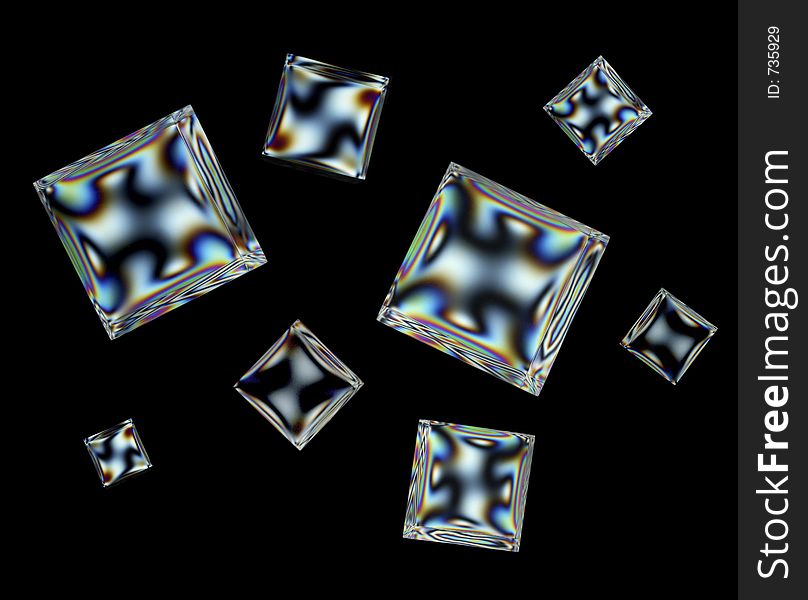 Acrylic cubes exposed through crossed polarized filters to reveal stress patterns. Acrylic cubes exposed through crossed polarized filters to reveal stress patterns.