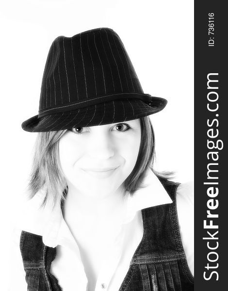 Black and white close up of beautiful young woman in pin striped hat. Black and white close up of beautiful young woman in pin striped hat.