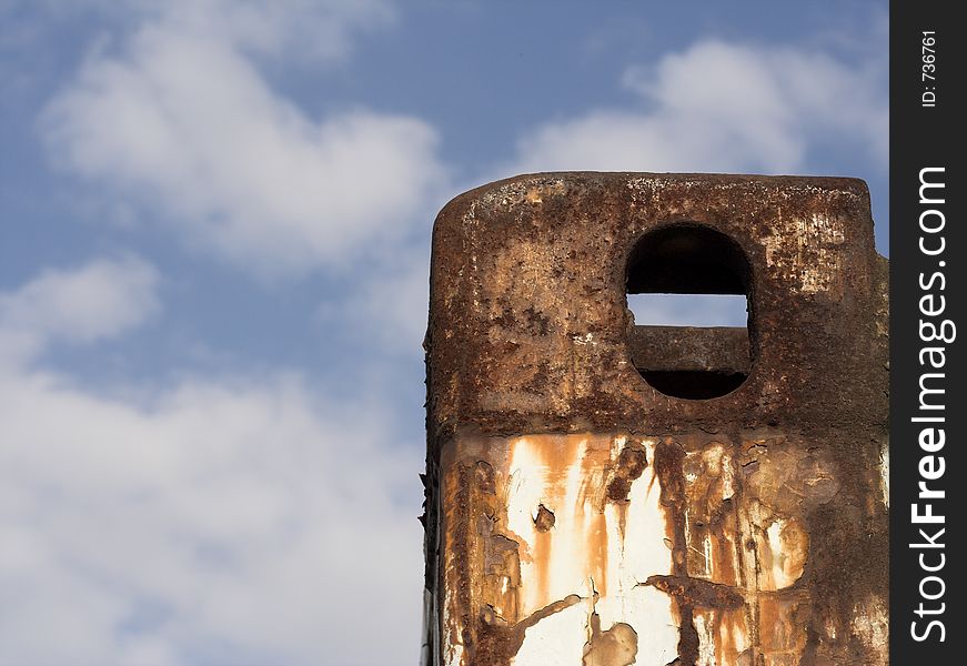 Rusty piece of metal with a nice sky background. Rusty piece of metal with a nice sky background