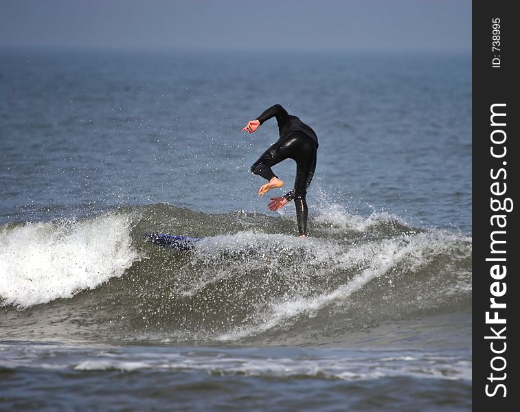 A bodyboarder rides a wave in Assateaque Island. Maryland. USA. A bodyboarder rides a wave in Assateaque Island. Maryland. USA