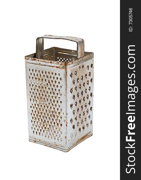Old grater with use traces. It is isolated on a white background. Old grater with use traces. It is isolated on a white background.