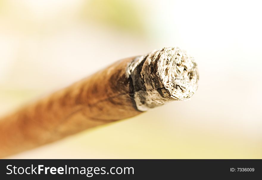 Cigar on wooden background (shallow DOF)