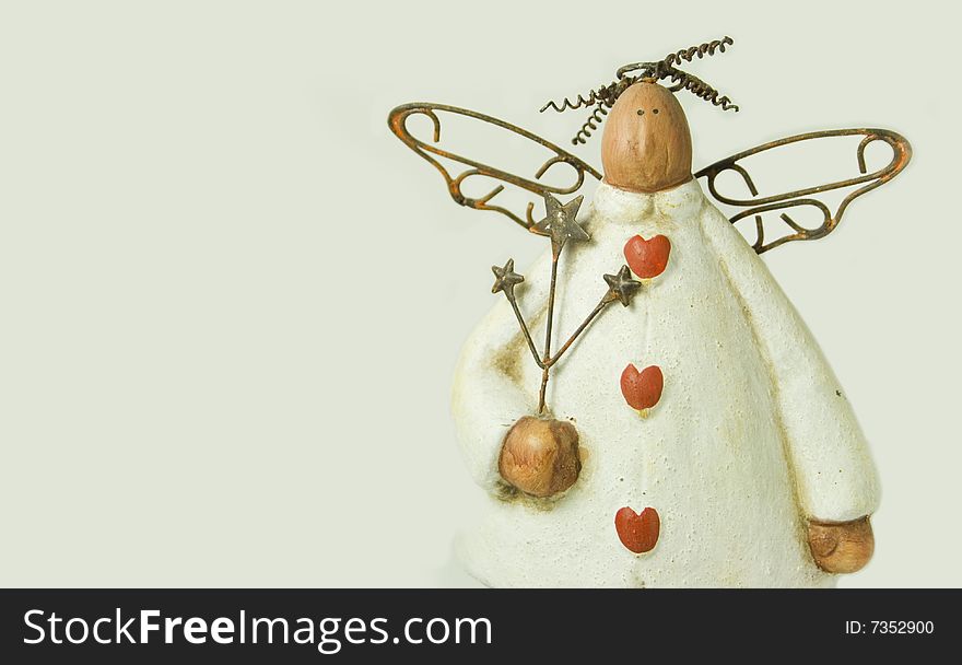 Miniature angel with rusty wings. Miniature angel with rusty wings