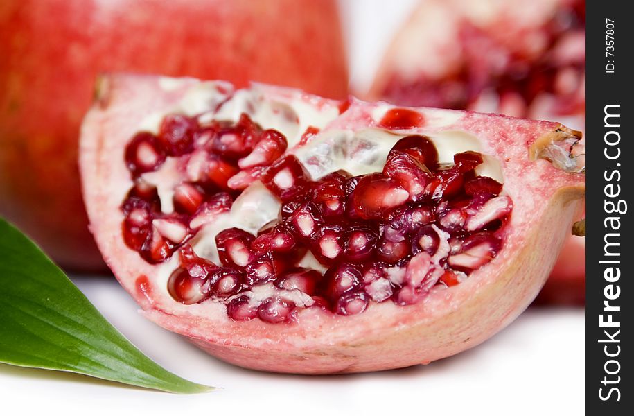 Pomegranate seeds isolated on white