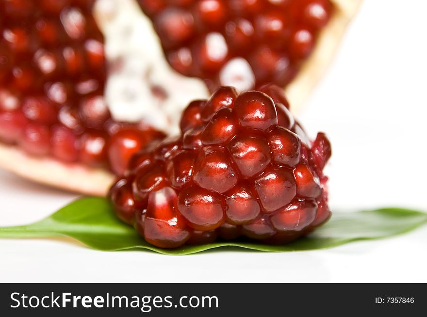 Pomegranate seeds isolated on white