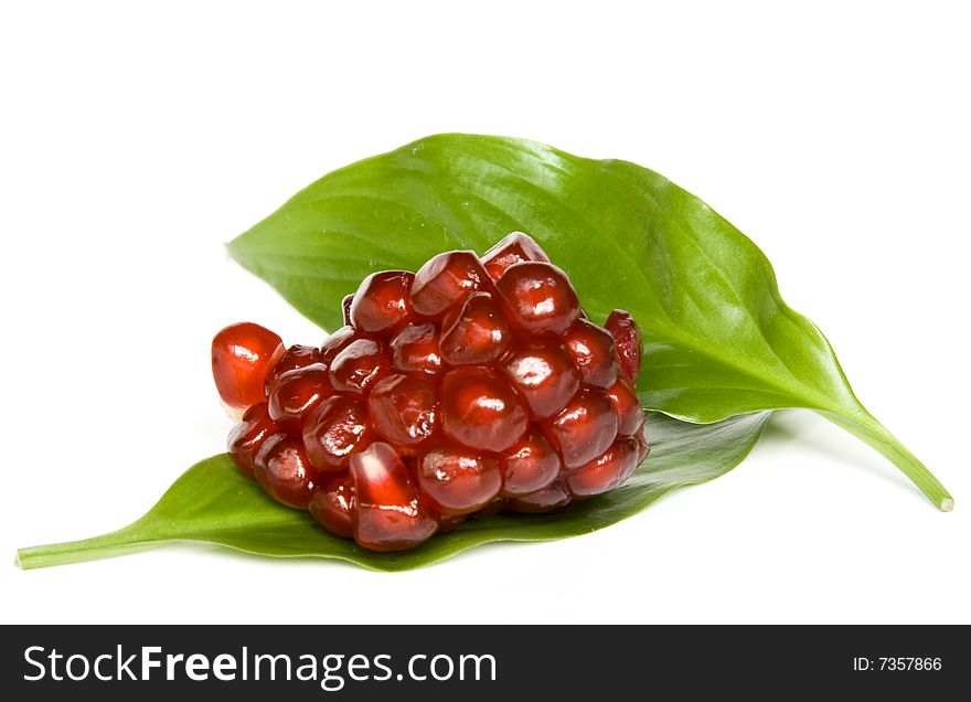 Pomegranate seeds isolated on white