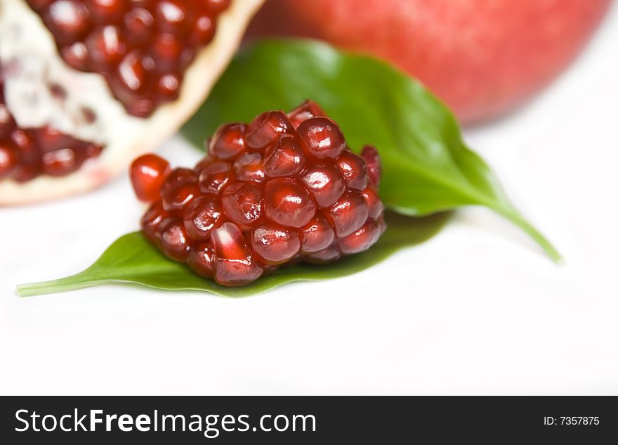 Pomegranate seeds isolated on white