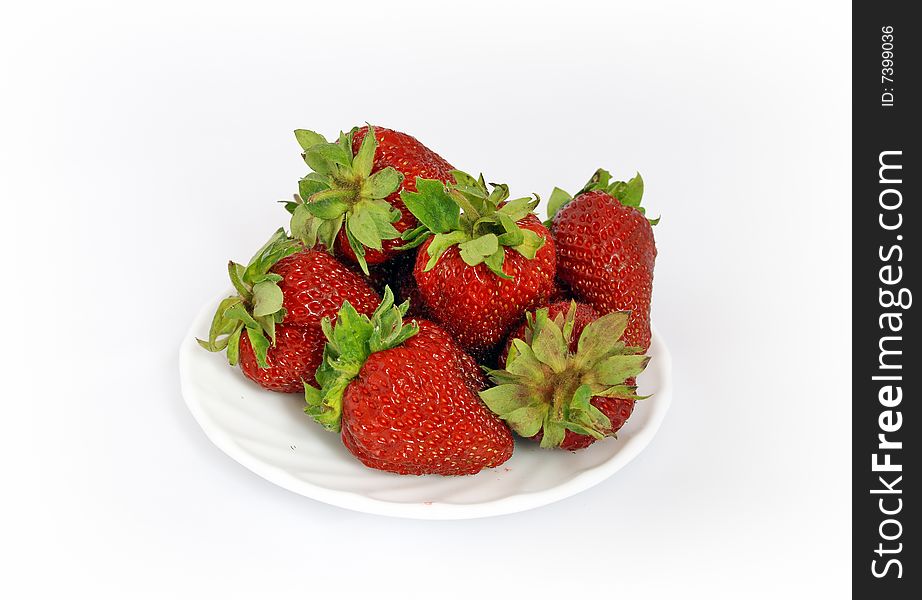 Plateful of a big strawberries. Isolated strawberries on white background. Plateful of a big strawberries. Isolated strawberries on white background.