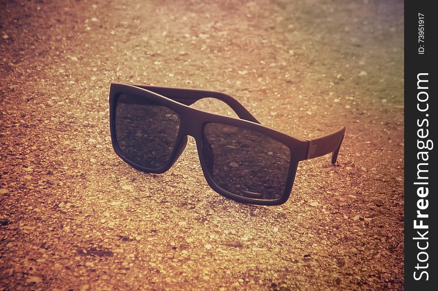 Summer picture with sunglasses on the beach in the sunny morning. Summer picture with sunglasses on the beach in the sunny morning